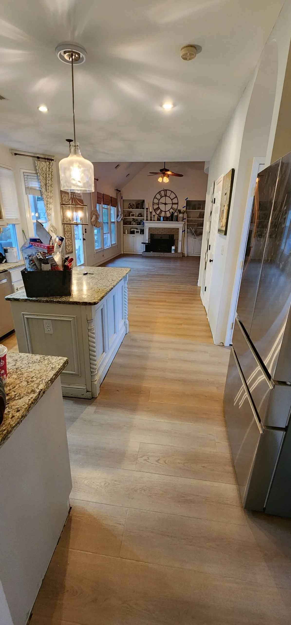 Luxury vinyl plank flooring throughout a kitchen and family room