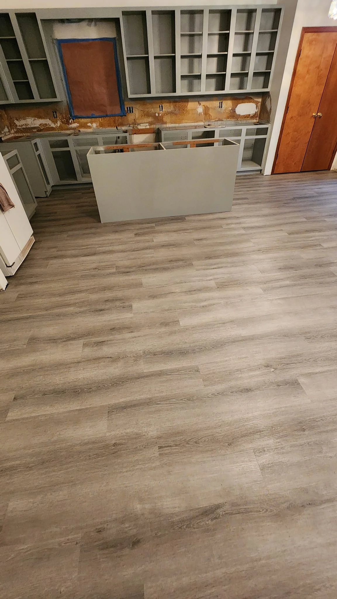 Luxury vinyl plank flooring in a renovated kitchen